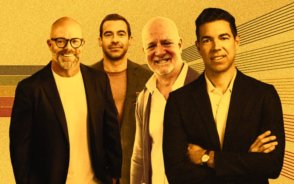 Group portrait of four smiling professional men standing side by side against a stylized graphic background, representing leadership at the launch of a new real estate development firm.