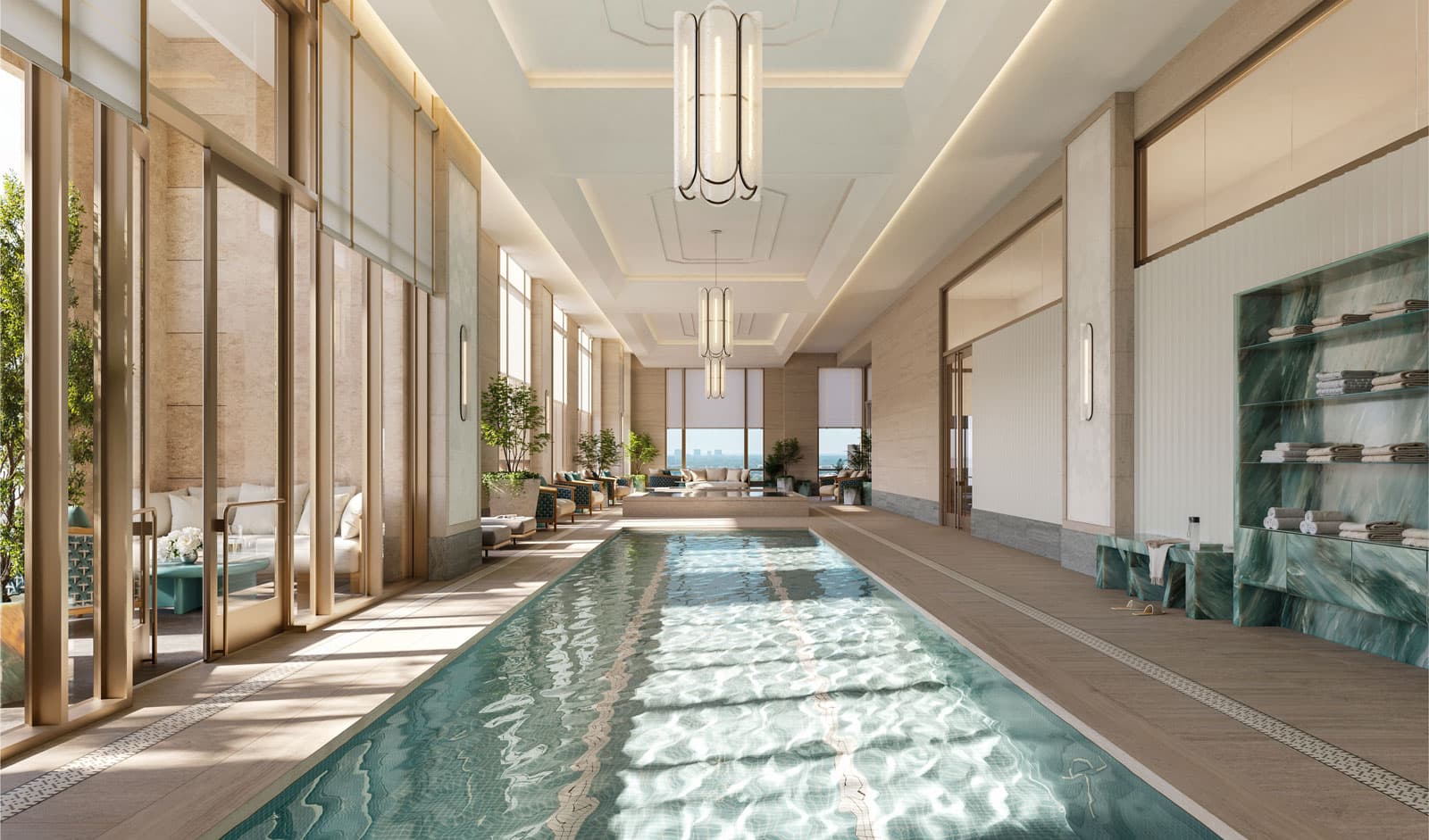 Long outdoor residential lap pool on a terrace with lounge chairs and landscaped planters, positioned beside a modern high-rise tower at The Ritz-Carlton Residences, Houston